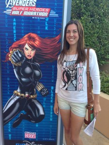 Editor Amy with the Black Widow banner for the RunDisney Avengers weekend.